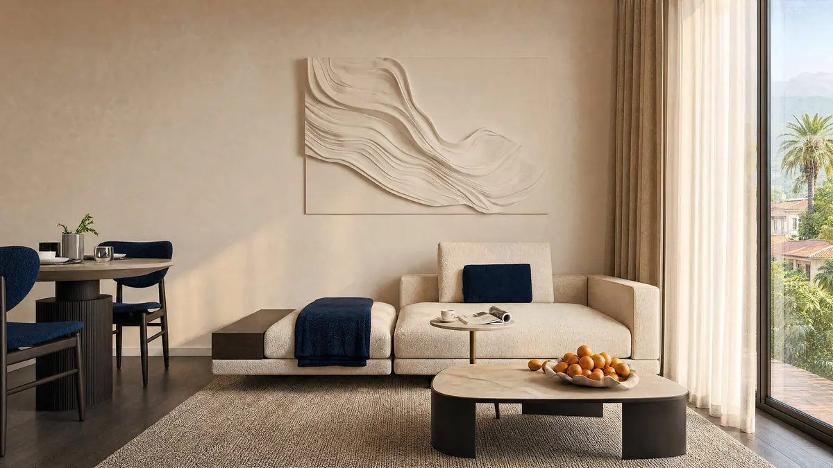 A living room with a sofa and a dining area by the window