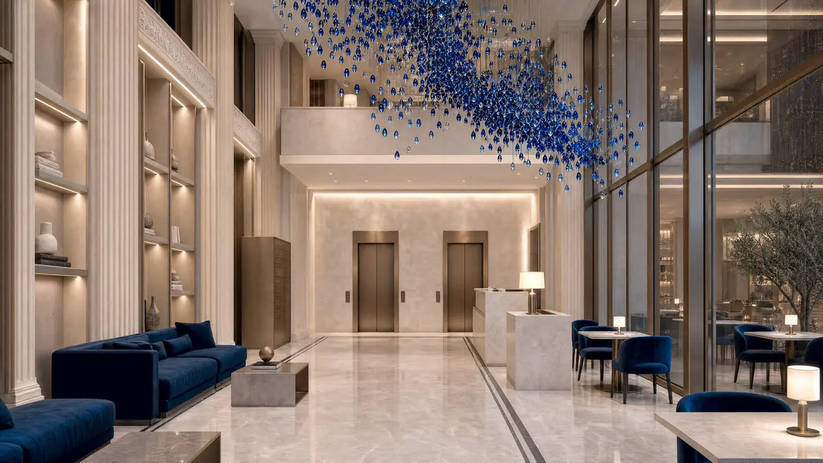 The lobby: pale marble, blue sofas and an installation of glass drops under the ceiling